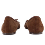 Brown suede ballet flats heel view with bow tie and low stacked sole