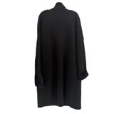 Long black knit cardigan with draped back, wide sleeves, patch pockets.