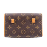 Brown monogram belt bag with structured flap and tan buckle tabs