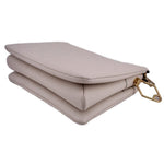 LOUIS VUITTON Coussin MM crossbody bag in white, angled side view with gold clasp