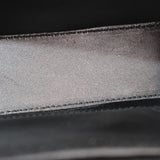 Black leather bag close-up of interior panel with stitched seam