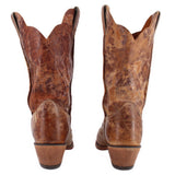 Brown cowboy boots with tall shafts and rear seam stitching above a cushioned heel