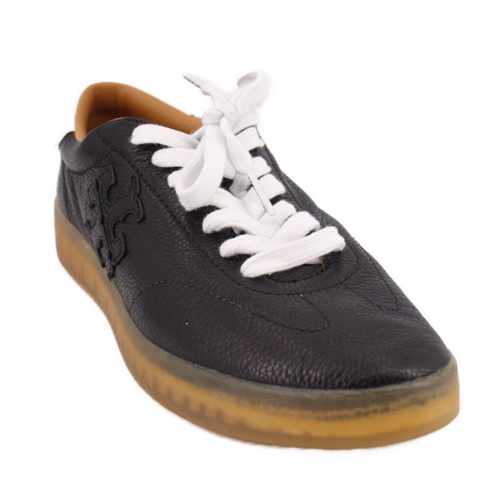 Black leather low-top sneakers with white laces and gum rubber sole