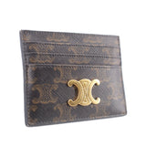 Brown card holder with gold-tone C logo on textured monogram canvas