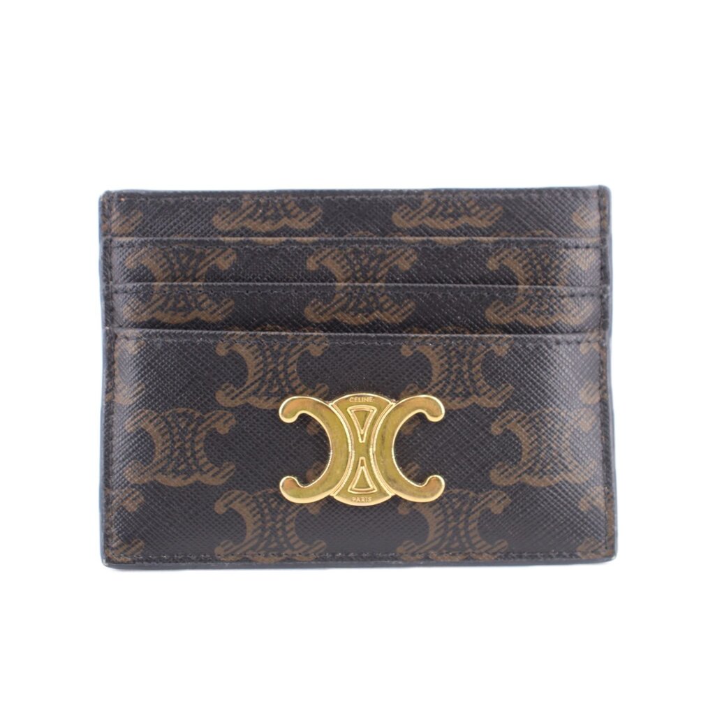 Brown designer card holder with gold-tone monogram emblem and embossed pattern