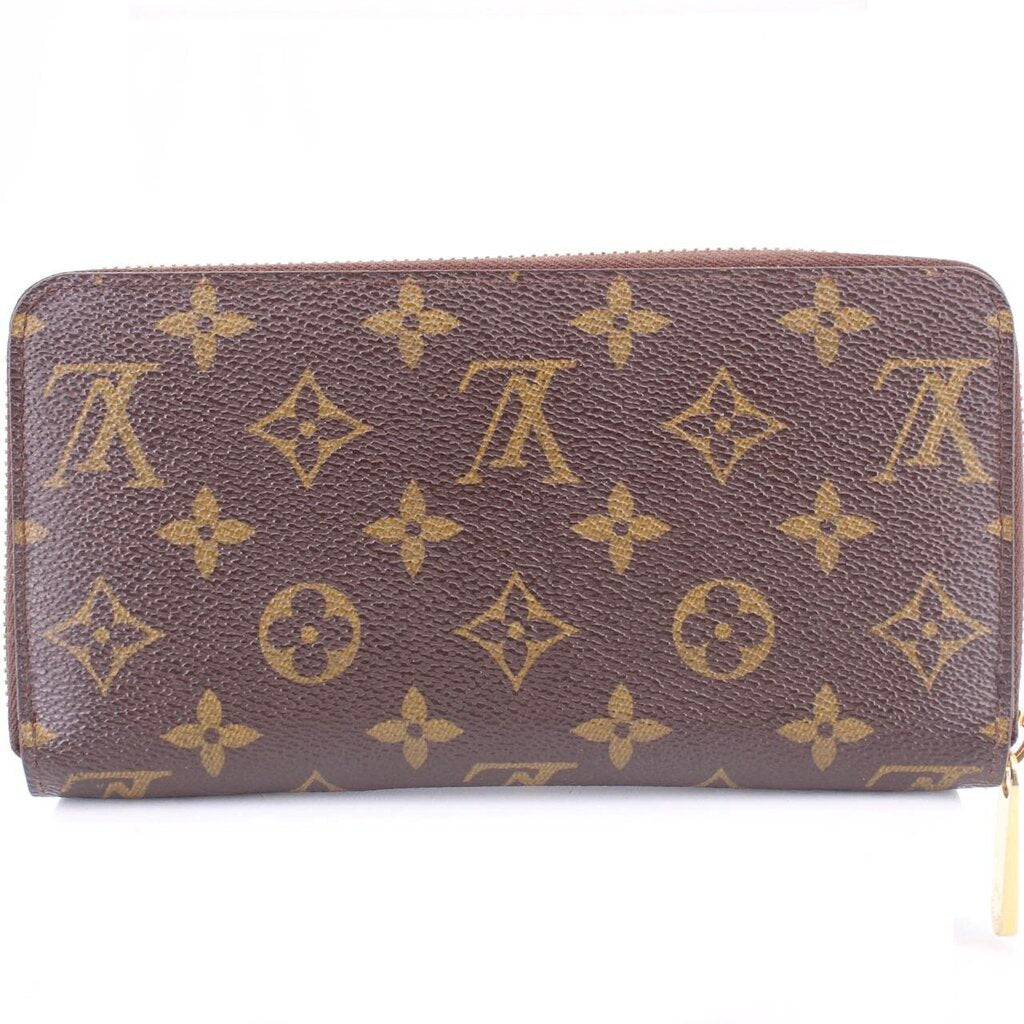 Monogram zip-around wallet front view in brown with repeating gold Louis Vuitton motif