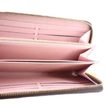 Zip wallet interior with pink lining, card slots, and gold zipper trim