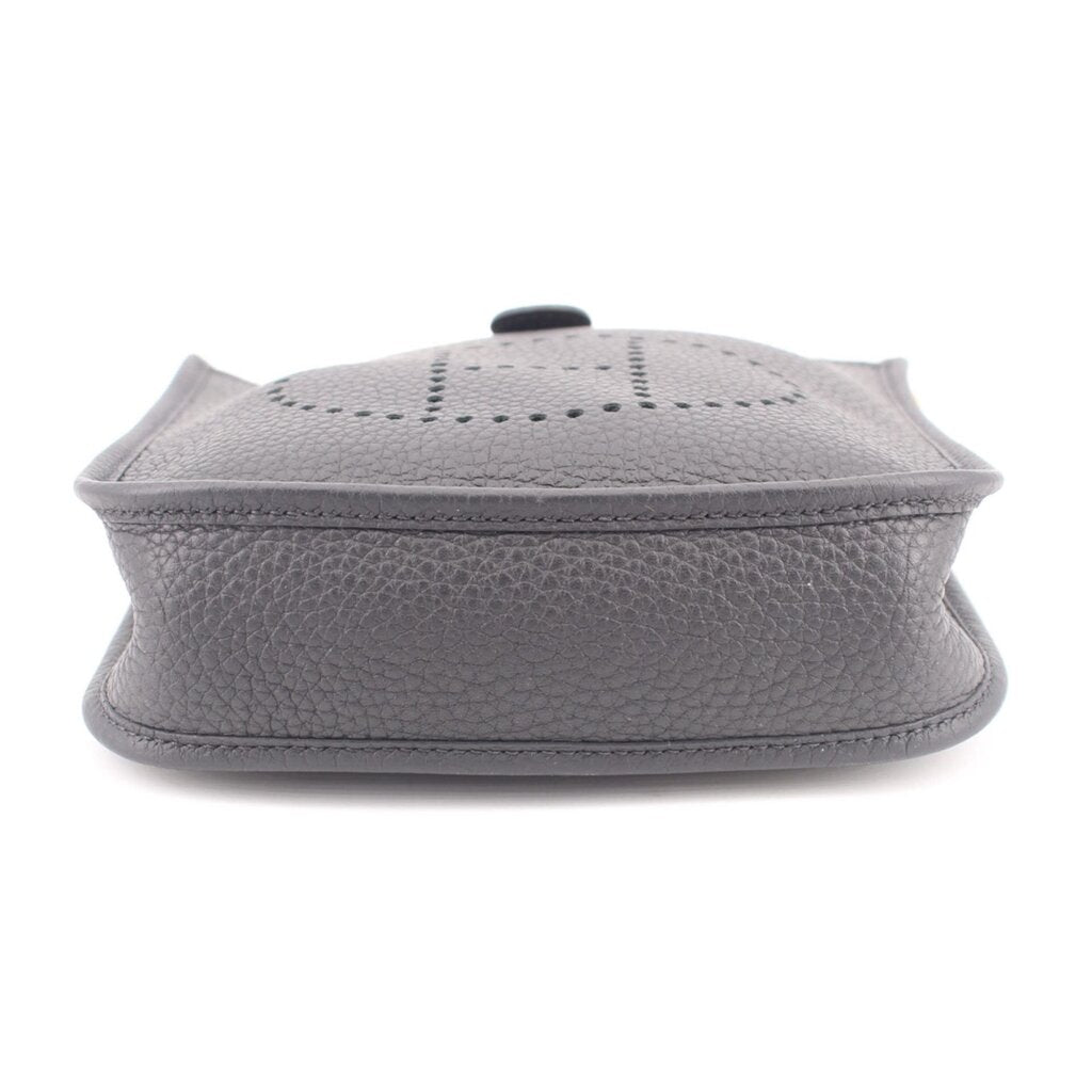 Small crossbody bag with perforated H logo on top flap, snap closure, light gray leather