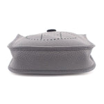 Small crossbody bag with perforated H logo on top flap, snap closure, light gray leather