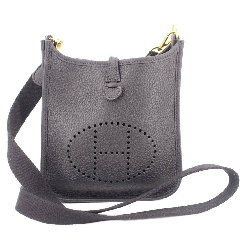 Small crossbody bag with perforated H logo, top snap, adjustable strap, dark leather