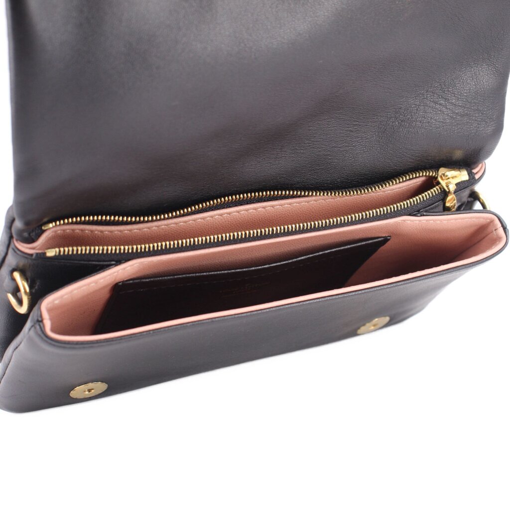 Black monogram crossbody bag interior with pink lining and gold zipper