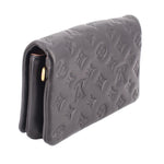Black embossed monogram crossbody bag side profile with gold chain strap