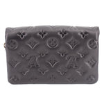 Black embossed monogram crossbody bag with zipper top and curved front