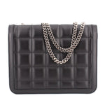 Black quilted shoulder bag with flap closure and silver-tone chain strap; front view.