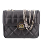 Black quilted shoulder bag with flap, gold-tone logo clasp, and linked chain strap.