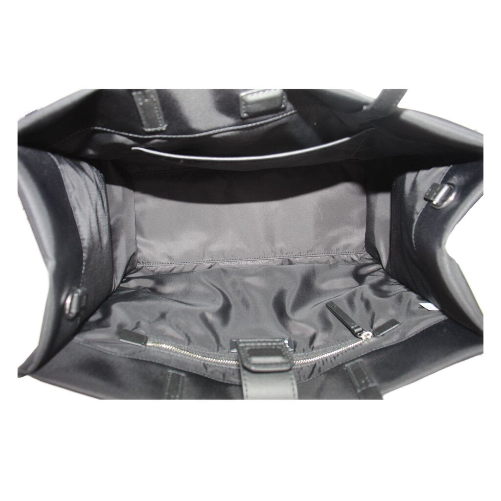 Black tote interior lining with zippered pocket and silver-toned hardware