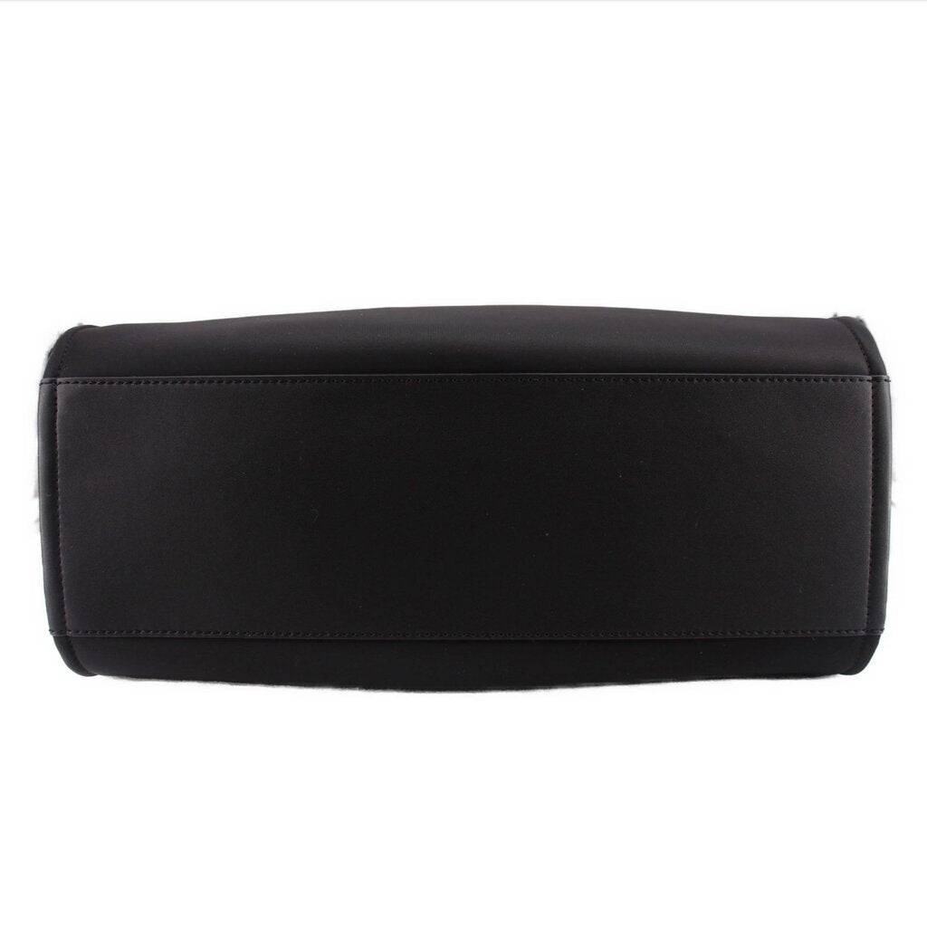 Black small tote bag with top edge seam and structured rectangular base