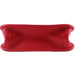 Red leather crossbody bag back view with seam across the top edge