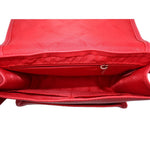 Red leather crossbody bag interior showing lined compartment and zipper pocket