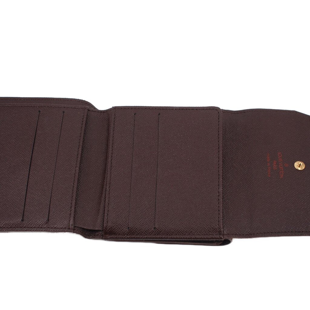 LOUIS VUITTON Elise wallet interior with multiple card slots and logo stamp.