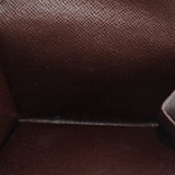 Damier Ebene wallet interior close-up showing fabric lining and compartment seams.