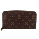 Monogram zip-around wallet in brown with gold-tone hardware, full-pattern canvas.