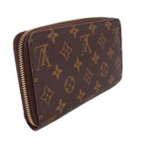 Brown monogram zip-around wallet shown in three-quarter view with gold zipper.