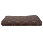 Brown monogram zip-around wallet laid flat with gold zipper edging.