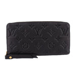 LOUIS VUITTON zip-around wallet in black embossed Monogram leather with zipper closure