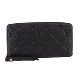 LOUIS VUITTON zip-around wallet in black embossed Monogram leather with zipper closure