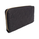 LOUIS VUITTON zip-around wallet angled view, black embossed leather and gold zipper
