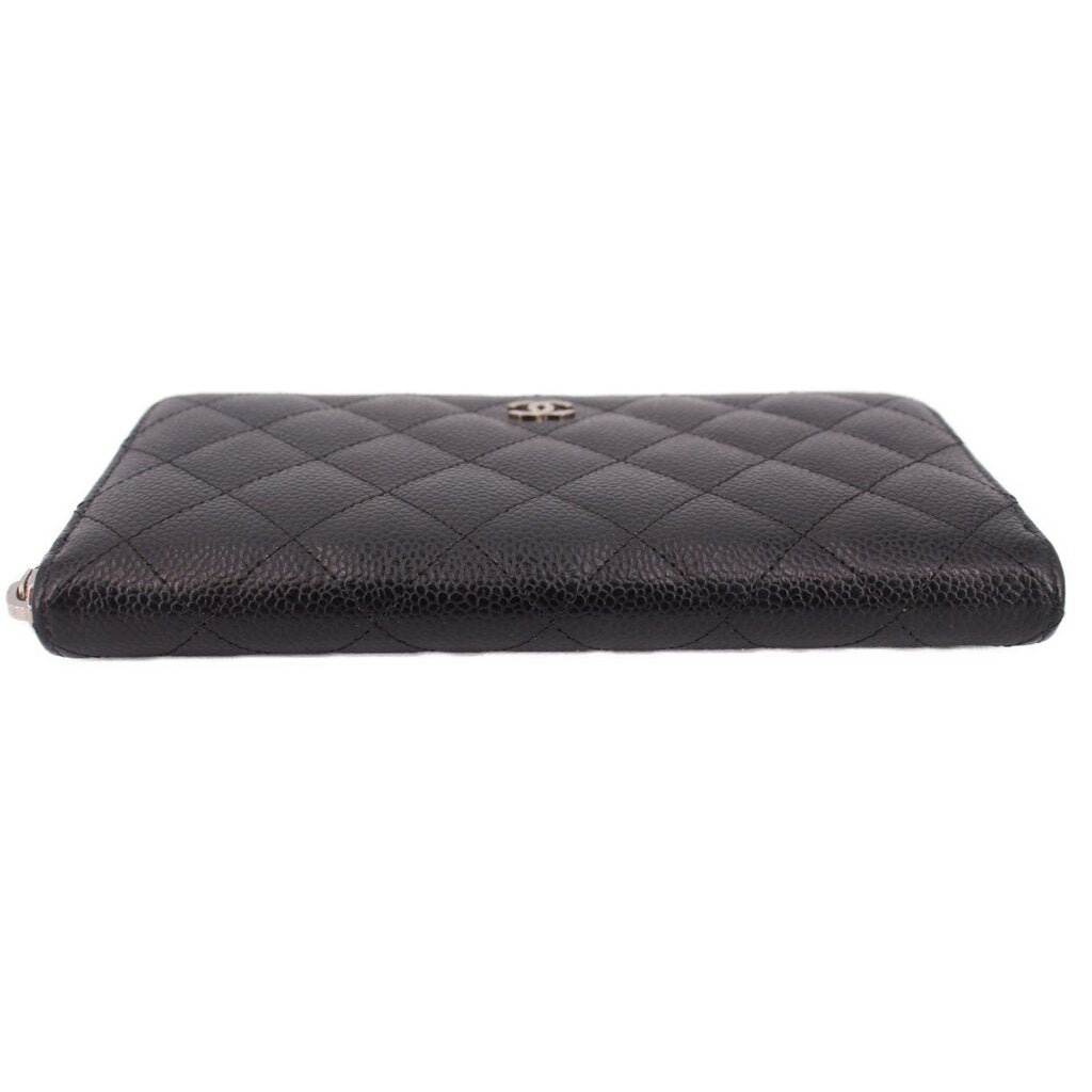 CHANEL quilted black zip-around wallet with smooth top edge and no visible contents