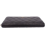 CHANEL quilted black zip-around wallet with smooth top edge and no visible contents