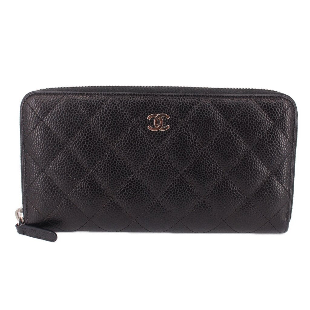 CHANEL zip-around wallet in black textured leather with CC logo and gold-tone zipper pull