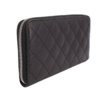CHANEL quilted black zip-around wallet with CC logo and gold-tone zipper stitching