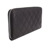 CHANEL quilted black zip-around wallet with CC logo and gold-tone zipper stitching