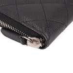 CHANEL black zip-around wallet corner close-up with zipper pull and metal hardware