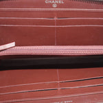 CHANEL zip-around wallet interior with burgundy lining and CHANEL label on the lining
