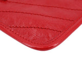 Red leather Niki pouch wallet corner with detailed edge stitching