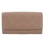 GUCCI taupe Continental wallet with embossed GG monogram and fold-over flap
