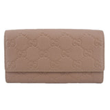 GUCCI taupe Continental wallet with embossed GG monogram and fold-over flap