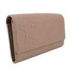 GUCCI taupe Continental wallet angled view with embossed GG monogram flap