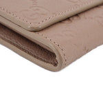 GUCCI taupe Continental wallet bottom edge close-up with stitched fold details