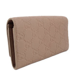 GUCCI taupe Continental wallet side view with embossed GG monogram texture