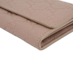 GUCCI taupe Continental wallet corner close-up with topstitched leather edges
