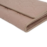GUCCI taupe Continental wallet corner close-up with topstitched leather edges