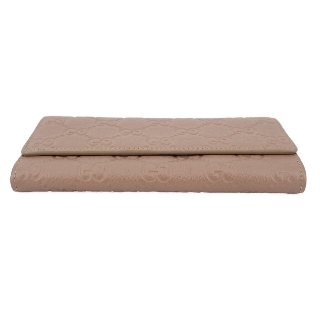 GUCCI taupe Continental wallet folded lay-flat view with embossed GG pattern