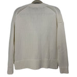 Back of the white knit cardigan with raglan seams and ribbed cuffs and hem