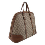 Brown GG canvas dome handle bag with zip top and curved leather bottom panels