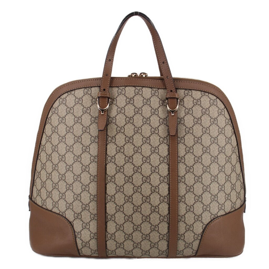 Brown GG canvas dome handle bag with front leather panels and metal handle hardware